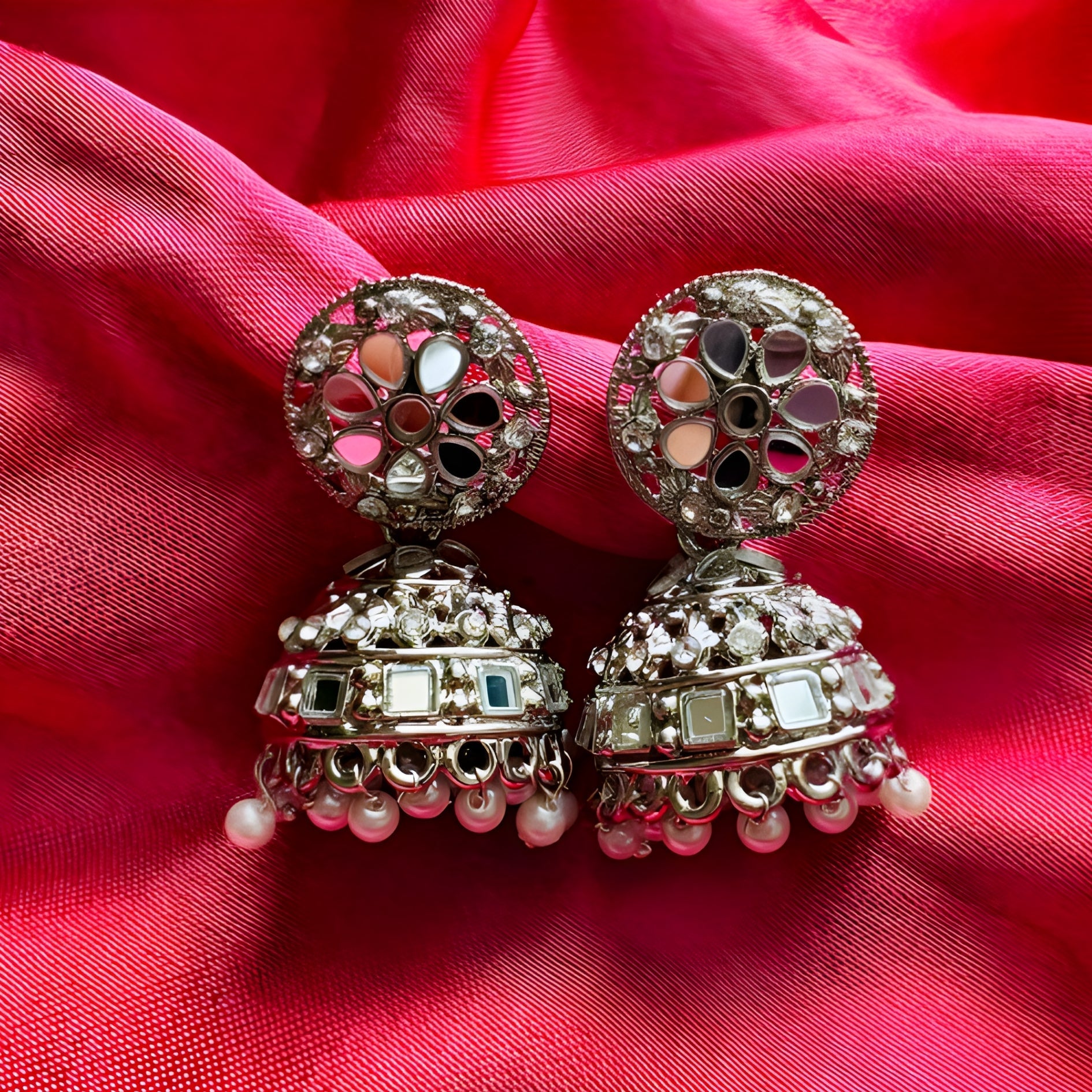 pair of oxidised silver mirror work jhumka earrings