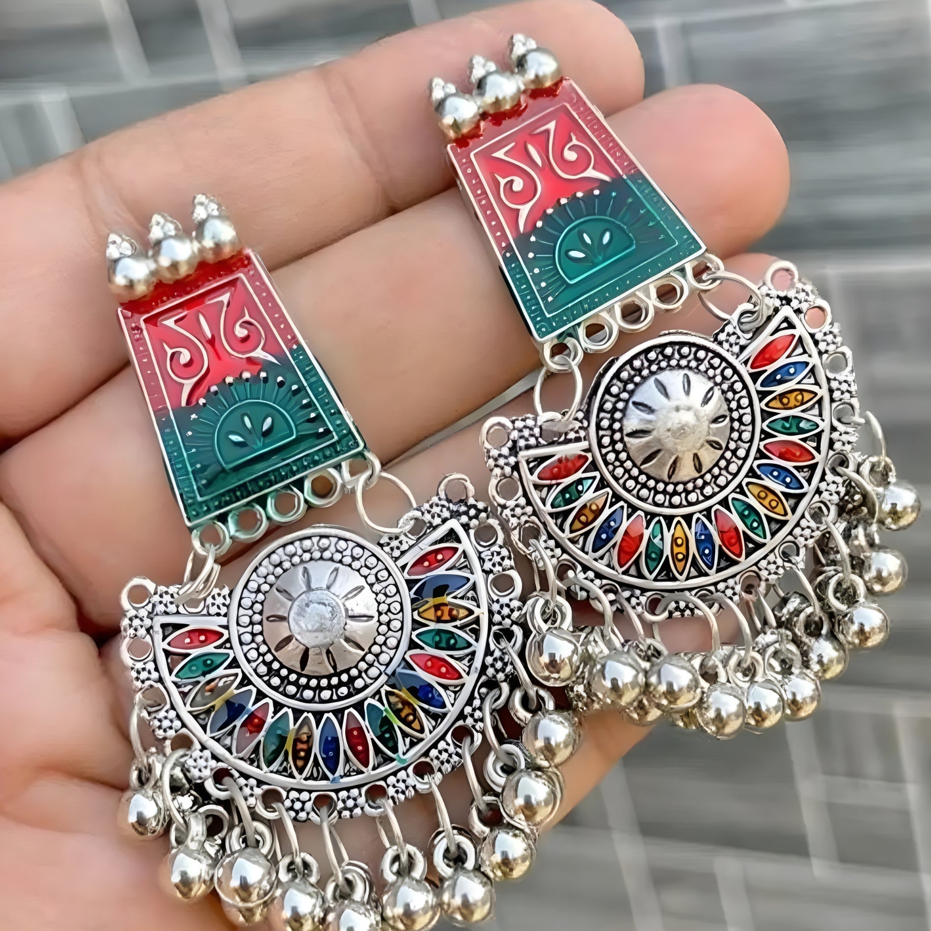 pair of multicolour oxidised silver-plated Meenakari Chandbali jhumka earrings.